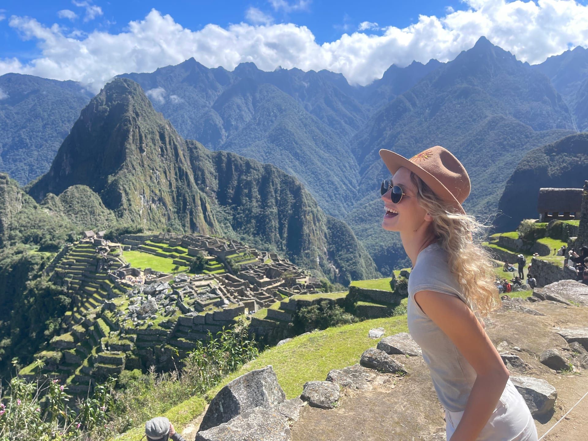 A woman taking in the view of Machu Picchu - Shamanic Trekker journey to the Source