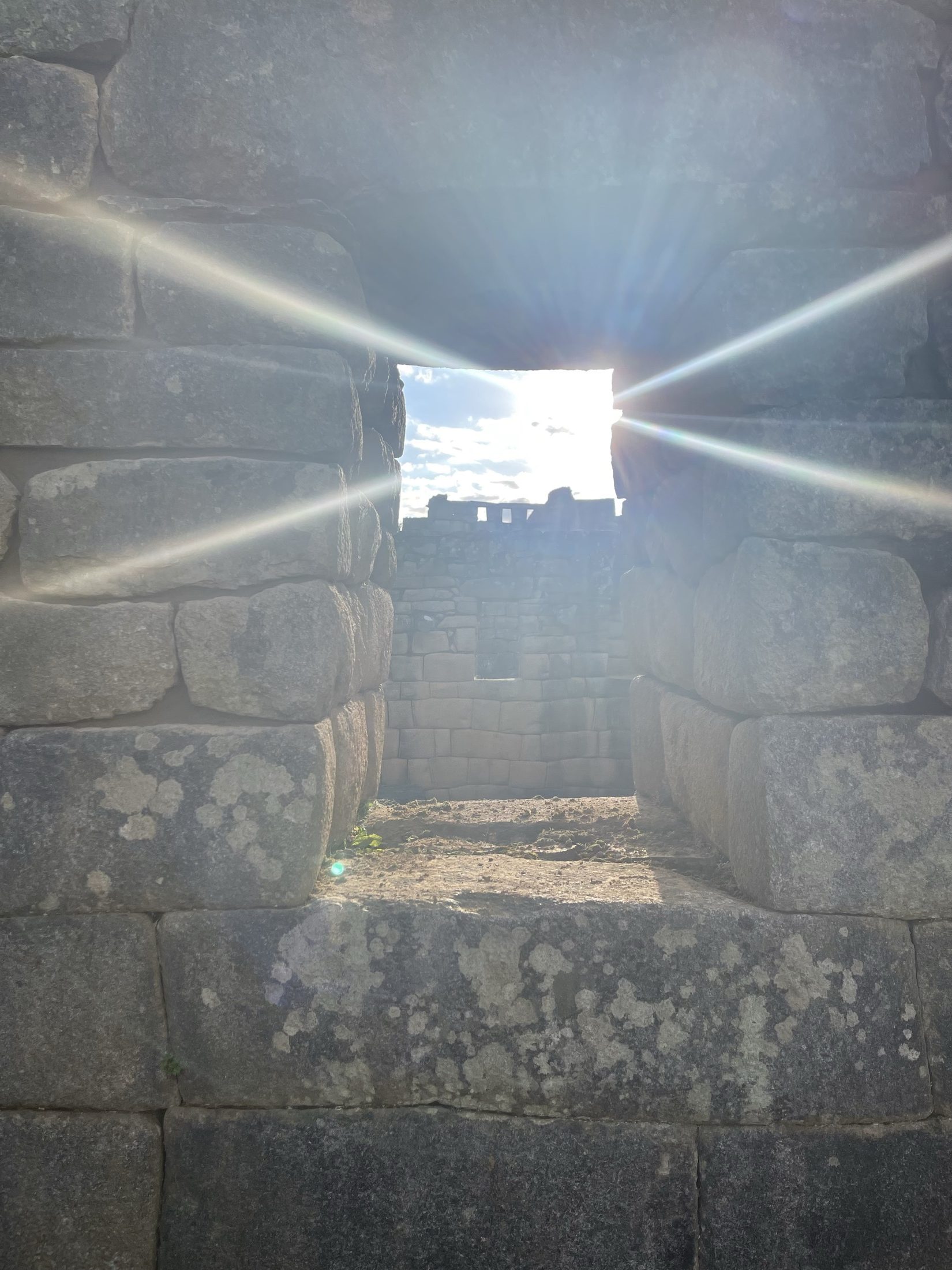 Sunlight through an ancient stone doorway at Machu Picchu