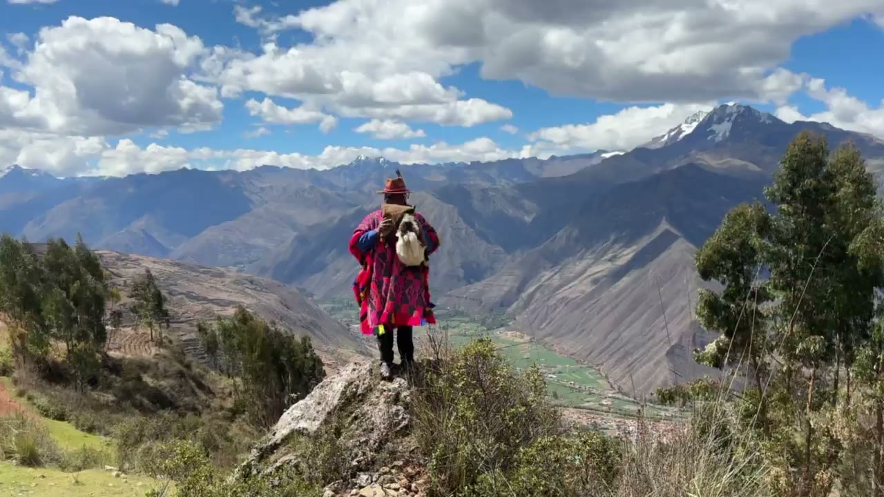 A Q'ero shaman sounding the pututu over the Sacred Valley - Journey to Peru with Indigenous Shamans of the Andes - Shamanic Trekker